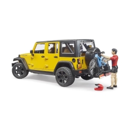 Jeep Wrangler Rubicon jaune avec cycliste